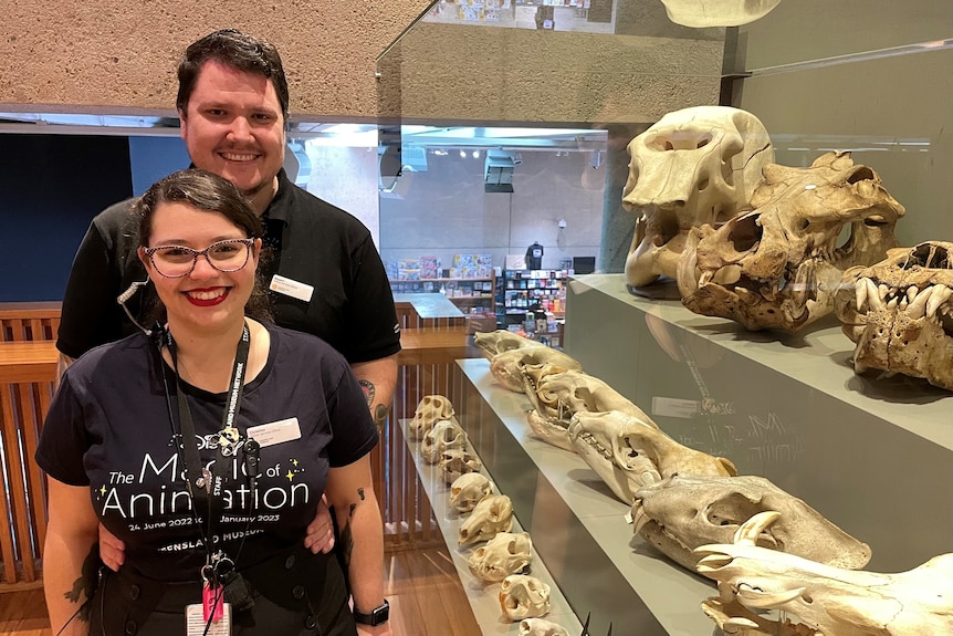 Couple standing in front of fossils