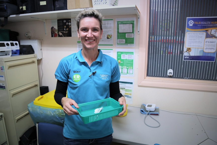 A nurse holds a basket containing a coronavirus vaccine