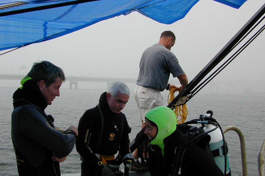 Conservator Sue Bassett and archaeologists Kieran Hosty and Dr Kerry Lynch preparing to dive in Newport Harbour.