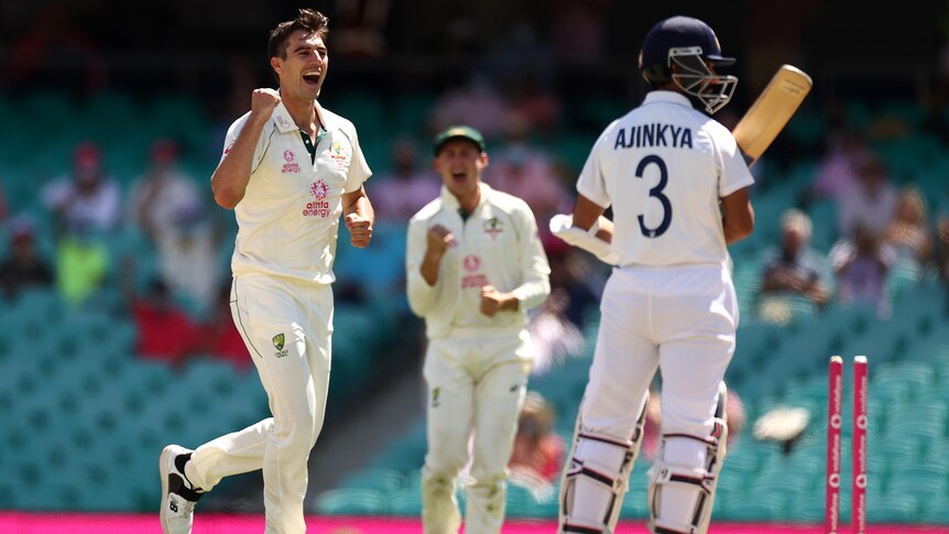 An Australian male bowler celebrates a wicket against India at the SCG in 2021.