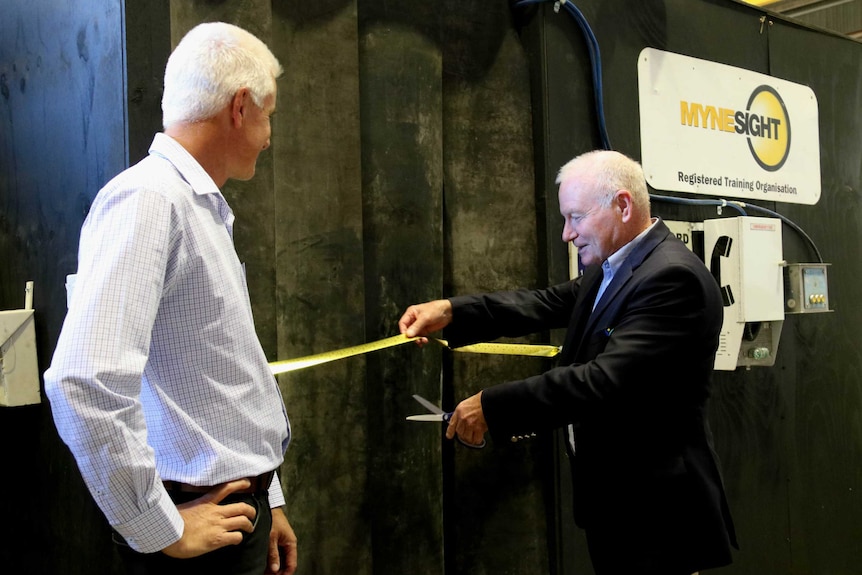 Wollongong Lord Mayor Gordon Bradbery cutting the ribbon on a new mine training facility in Cringila