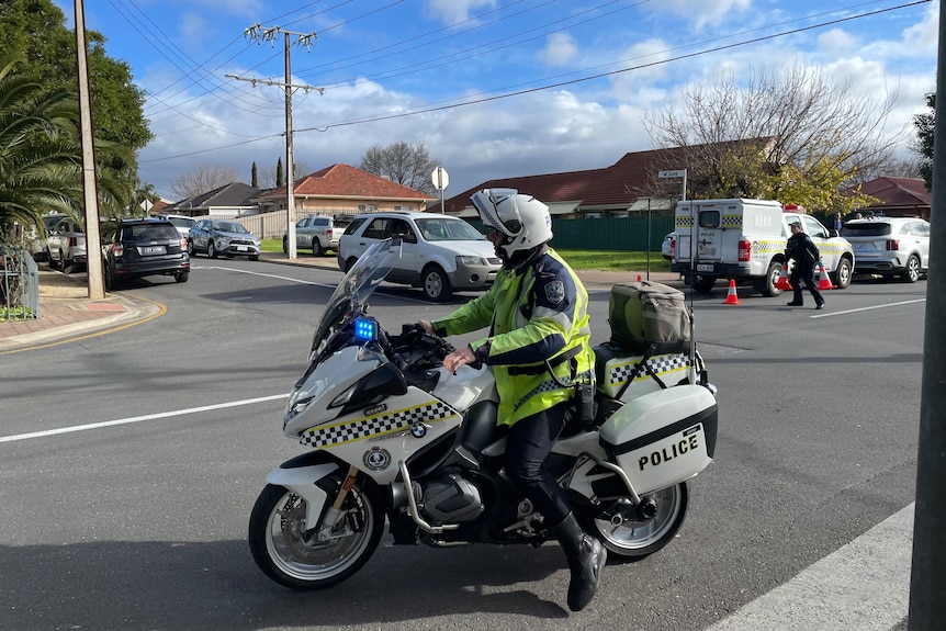 A police officer on a motorbike.