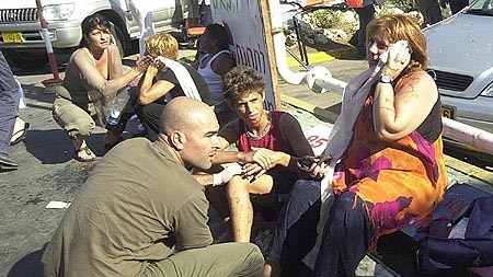 Wounded Israelis are helped at the scene