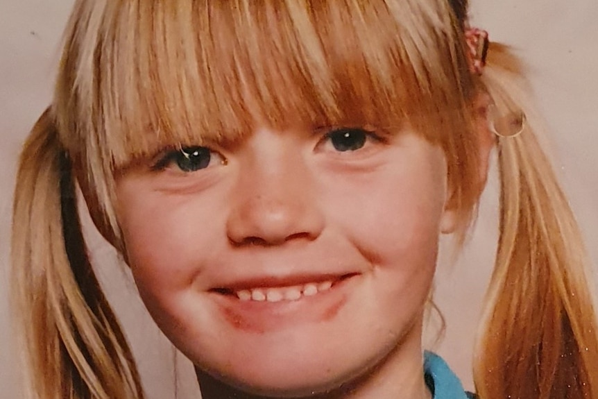 A school photo of Tabitha West smiling as a child.