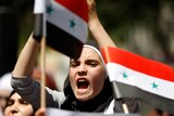 Syrian woman protests after Friday prayers