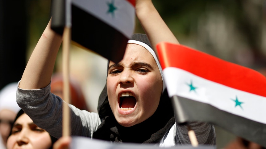 Syrian woman protests after Friday prayers