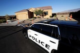 A Mesquite Police department vehicle is parked outside of the home of Stephen Craig Paddock.