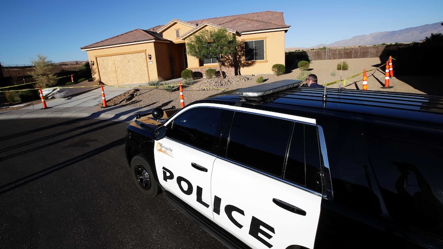 A Mesquite Police department vehicle is parked outside of the home of Stephen Craig Paddock.