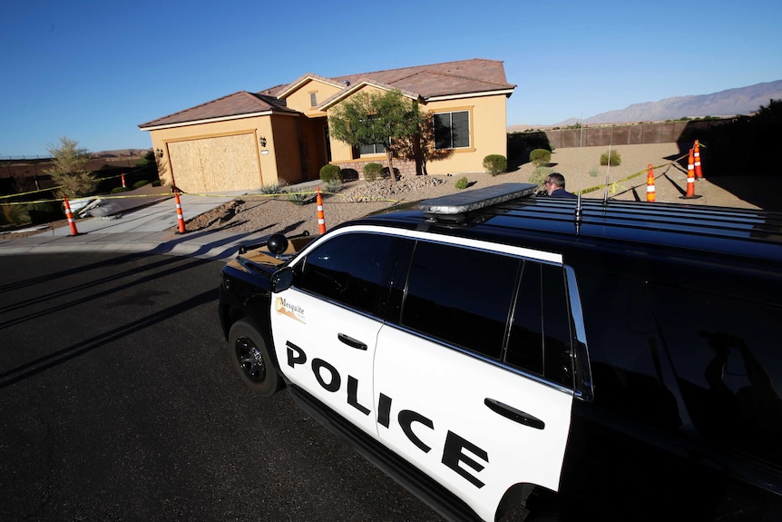 A Mesquite Police department vehicle is parked outside of the home of Stephen Craig Paddock.