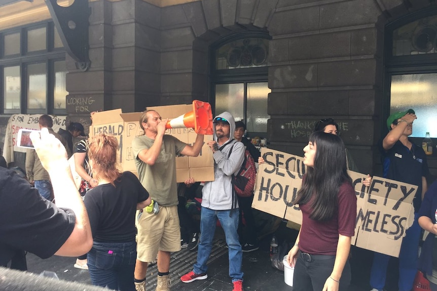 Protesters for a group of homeless people camped outside Flinders Street Station.
