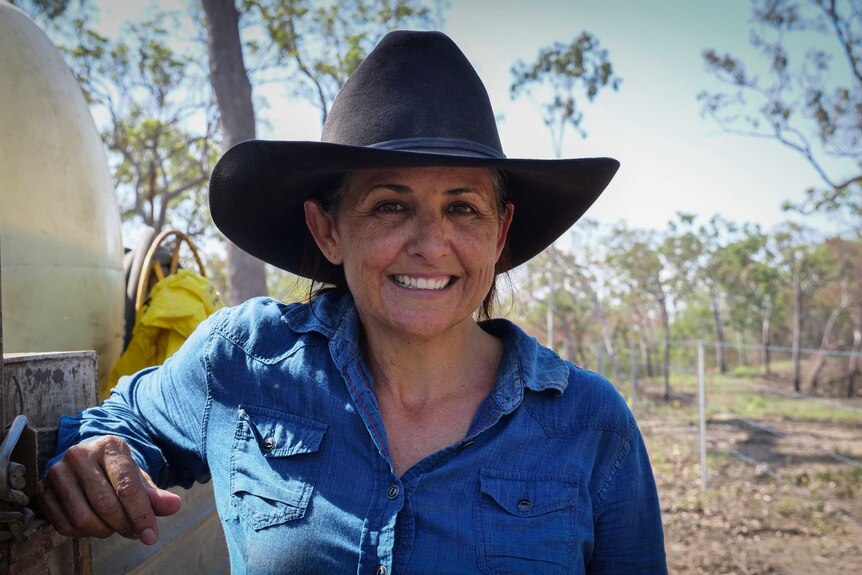 Tammy Schulte leaning on the side of the ute.