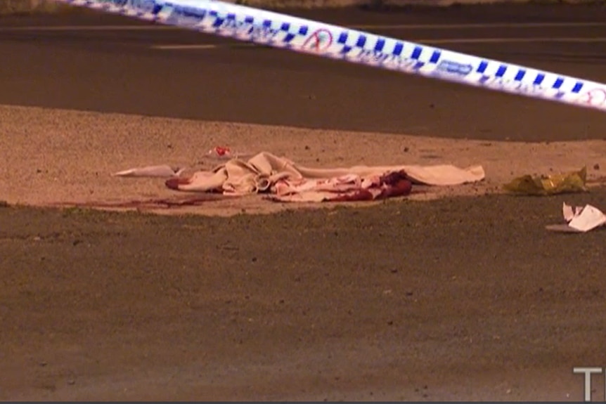 A bloody rag left lying on the footpath