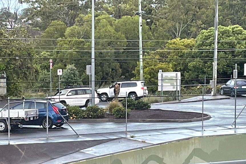 An officer in camouflage at the Sunnybank Siege.