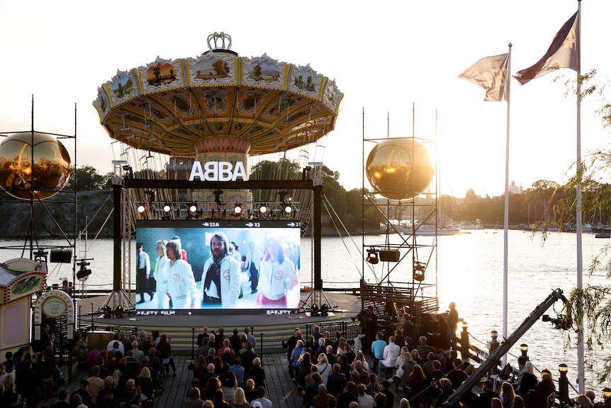 A view of a screen showing ABBA's Björn Ulvaeus and Benny Andersson being interviewed in London