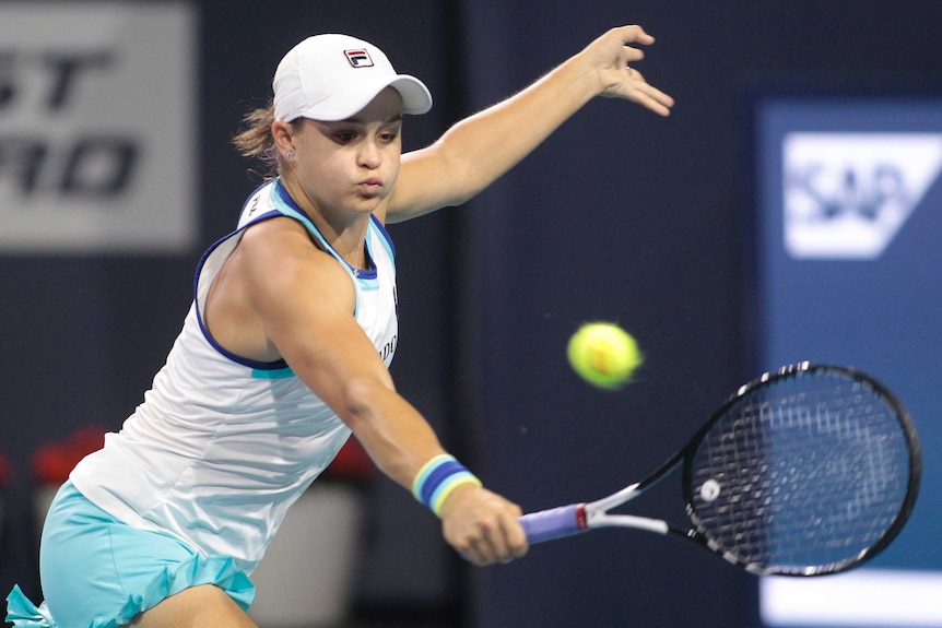 Ashleigh Barty stretches for a single-handed backhand at the Miami Open.