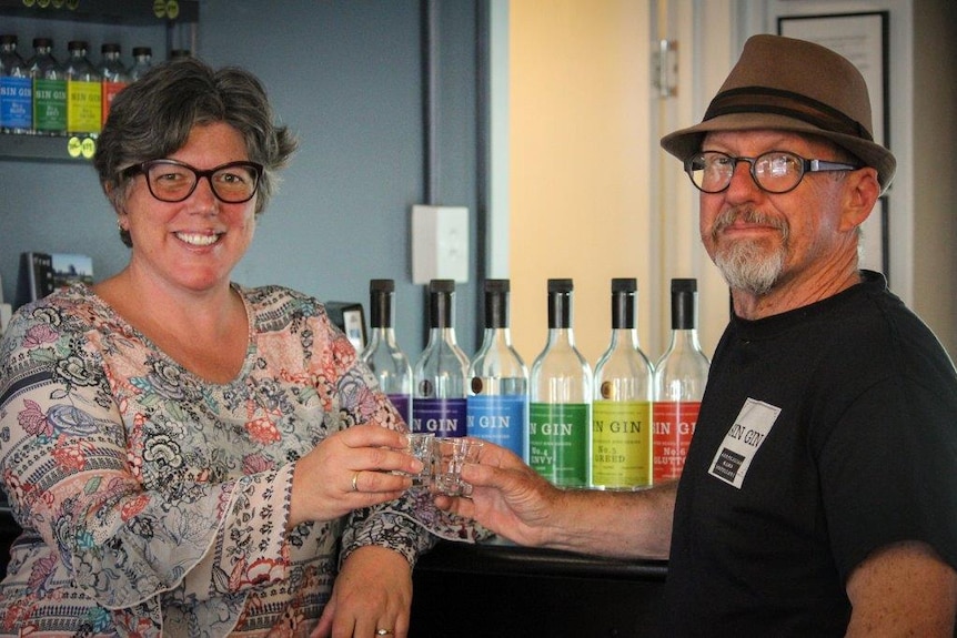 Kate Sinfield and Mark Harris toast at their West Perth bar.