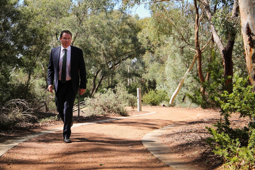 Nationals MP Andrew Broad walks the grounds of Parliament House in Canberra.