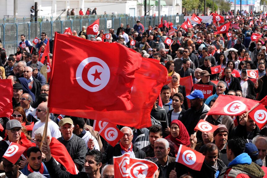 Thousands of people march through Tunisia's capital against extremism
