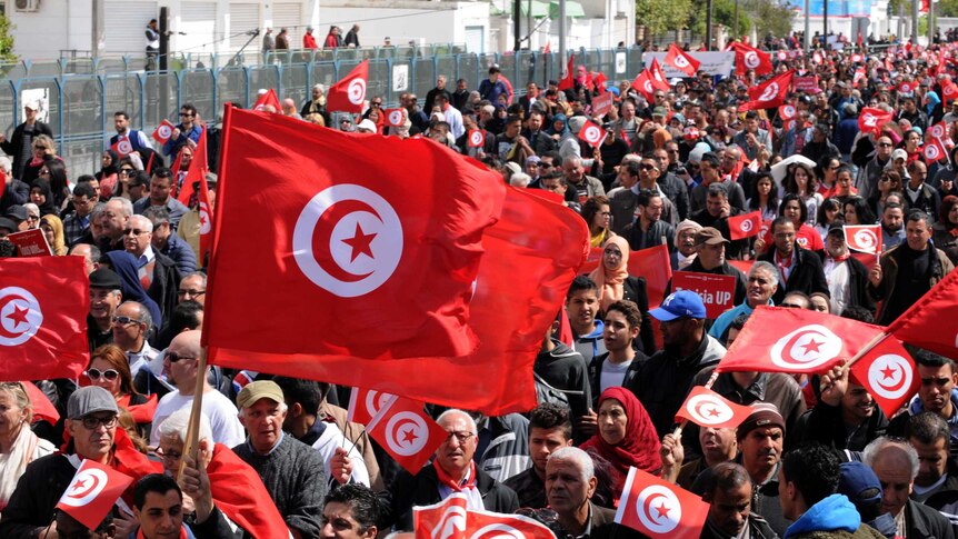 Thousands of people march through Tunisia's capital against extremism