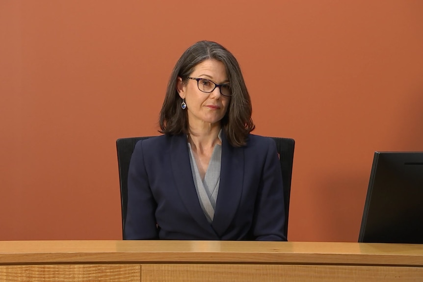 A woman sitting at a desk