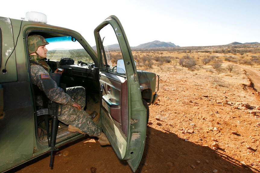 A member of the US National Guard patrols the Arizona-Mexico border in Sasabe, Arizona.