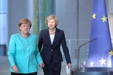 Angela Merkel and Theresa May.