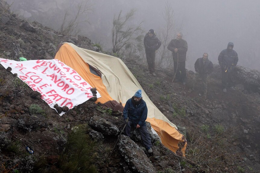 Vesuvius park workers hold a banner