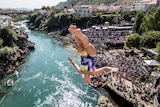 Rhiannan Iffland of Australia dives from the 21.5 metre platform on Stari Most.