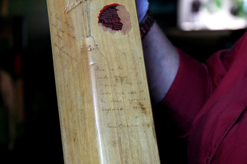 A close-up of a cricket bat owned by Don Bradman.
