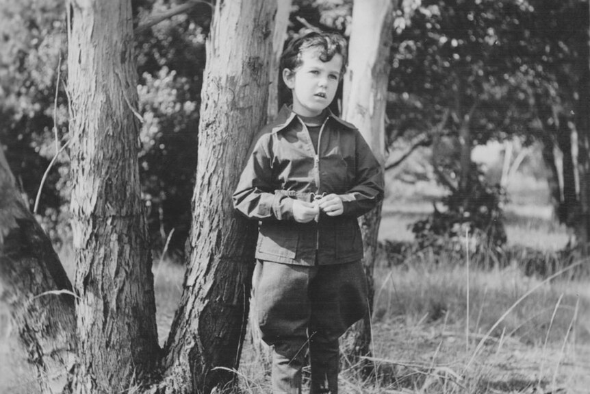 Black and white photograph of a young child in Kerever Park.