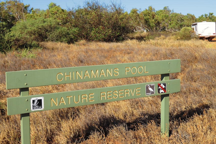 A national park sign in scrub land