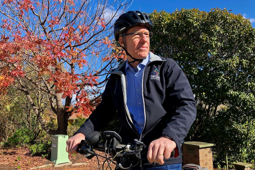 Stephen Hodge sits on his bike and looks to the side.