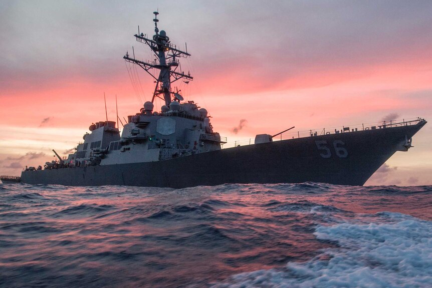 The USS John McCain conducts a patrol in the South China Sea.