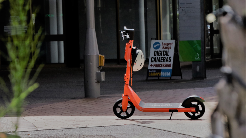 A lone orange e-scooter in the Darwin city mall.
