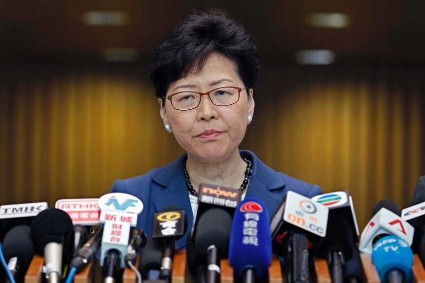 Hong Kong chief executive Carrie Lam listens to reporters' questions during a press conference.