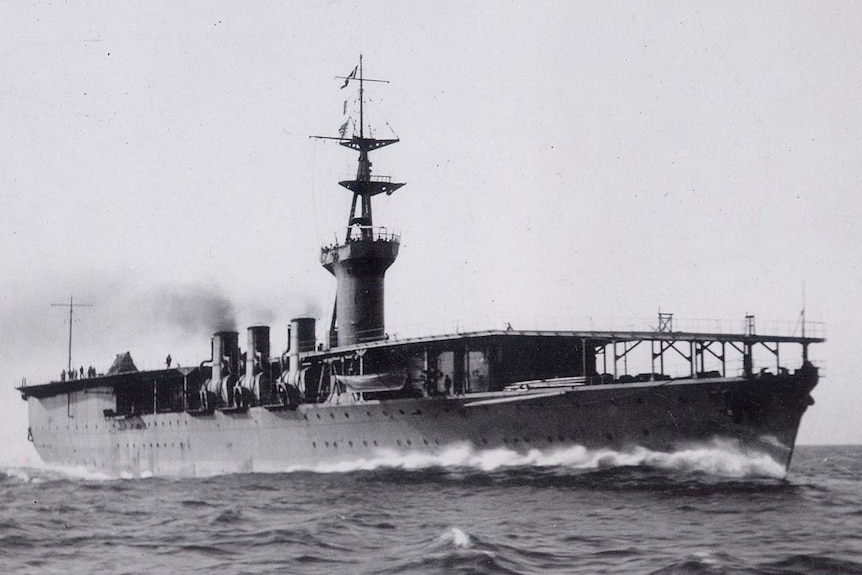 A black and white photo of the Imperial Japanese Navy's aircraft carrier, Hōshō out at sea.