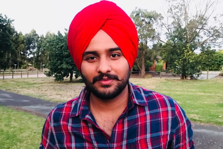 a man in a red turban