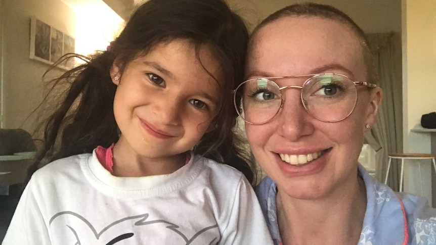 Elizabeth Pickworth, with a her head recently shaved, poses in a selfie with her daughter.