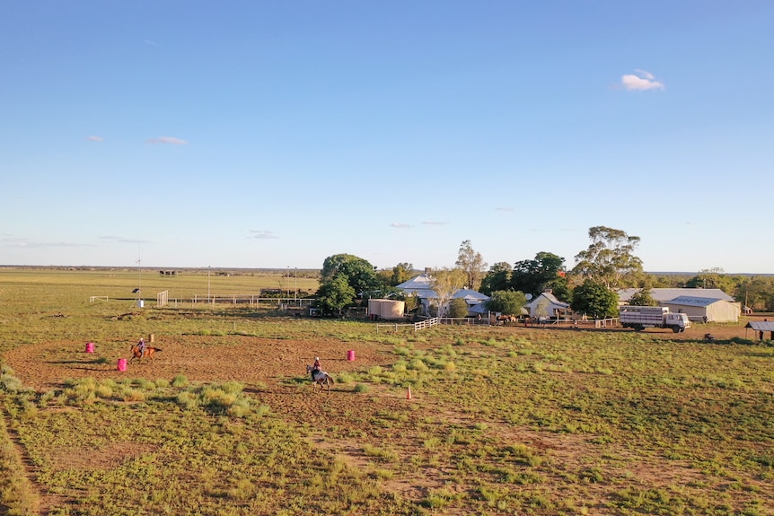 Aerial photo of Tyler and Jacy riding horses, near Winton,. November 2022.