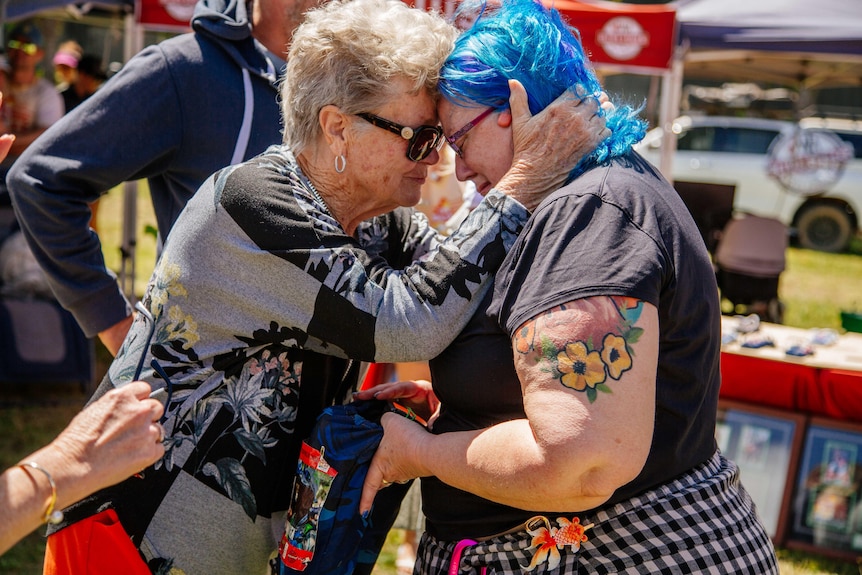 two women embracing in an emotional hug