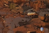 Brazilian mining dam floods neighbouring towns in mud