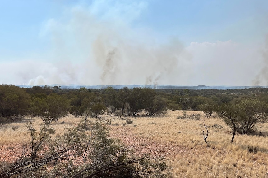 Smoke rises up from a central Australian station.