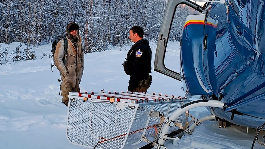 Tyson Steele speaking to rescuers in the snow.