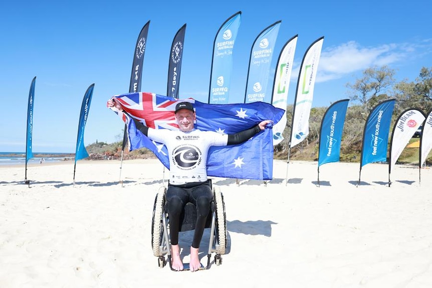 manin wheelchair with Australian flag