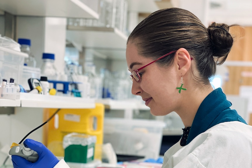 A young woman working in a medical research lab