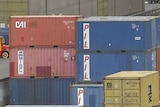 Shipping containers sit on a wharf in Tasmania