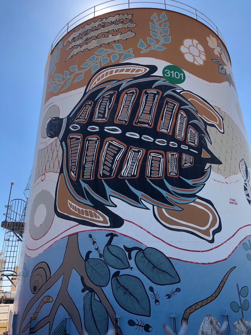 Large silos adorned with aboriginal art.