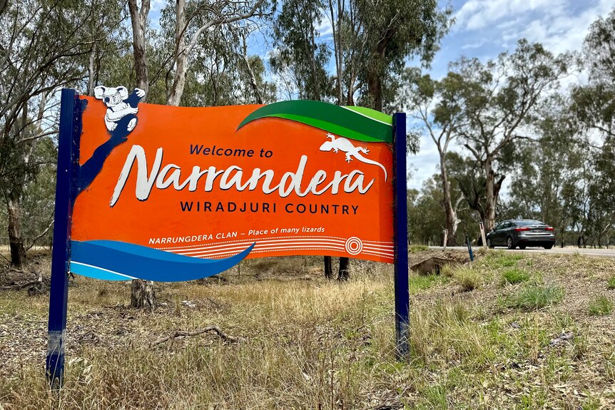 Large orange sign that reads 'Welcome to Narrandera, Wiradjuri country'.