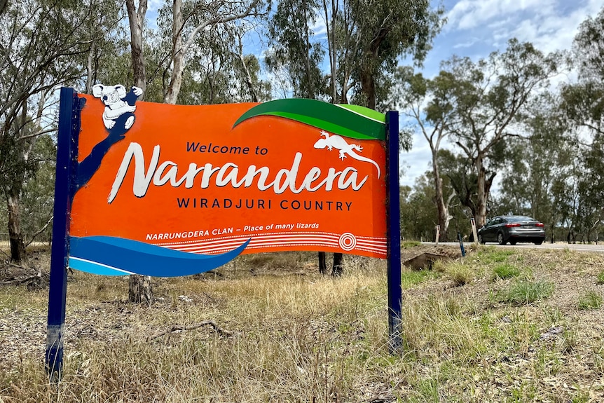 Large orange sign that reads 'Welcome to Narrandera, Wiradjuri country'.