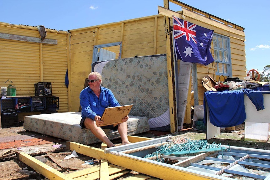 Robert Holness surveys the damage after his house in Marmor